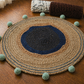 Coastal Weave Jute Round Rug with Pom-Pom Accents
