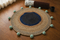 Coastal Weave Jute Round Rug with Pom-Pom Accents