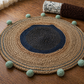 Coastal Weave Jute Round Rug with Pom-Pom Accents